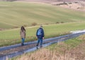 Ramblers walking on country road Royalty Free Stock Photo