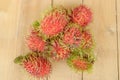 Rambutan fruit on wood plank Royalty Free Stock Photo