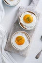 Ramekins baked eggs on white background, top view Royalty Free Stock Photo
