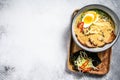 Ramen asian noodle soup with Beef tongue meat, mushroom and Ajitama pickled egg. White background. Top view. Copy space Royalty Free Stock Photo