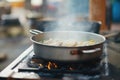 ramen cooking process in pot on stove, boiling water