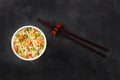 Ramen cup, instant noodles in a plastic cup, top shot with chopsticks Royalty Free Stock Photo