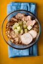 Ramen noodle soup, celery, chicken on a yellow table on the napkin Royalty Free Stock Photo