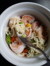 Ramen noodle variation with carrot, pea and shrimp.