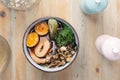 Ramen soup, top view, close-up. Bowl with Japanese soup with dark broth, vegetables and egg.