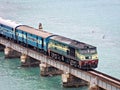 Rameshwaram, India- May 15th, 2014:Close up image of Passenger train crossing Pamban sea railway bridge Royalty Free Stock Photo