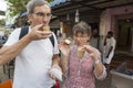 A local tea coffee tchai shop, an unidentified caucasian customers in front of the shop.