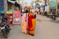 In the main street, Unidentified Hindu pilgrims people ready to go to the temple by walking, after the bath at the gate. Great tim