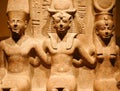 A Trio of Ancient Egyptian Statues: Ramesses II, Amun, and Mut Royalty Free Stock Photo