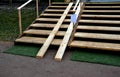 Ramp combined with a wooden staircase and a handrail specially adapted for wheelchairs. security tasteful solution for entering a