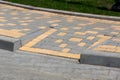 Ramp for lowering disabled persone from a pedestrian sidewalk.