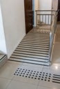 Ramp way with stainless steel handrail for support wheelchair disabled people infront of the disable toilet