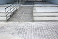 Ramp for the wheelchair and stairs for normal people adjoining background Royalty Free Stock Photo