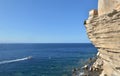 Fortress  above  limestone cliff  in Corsica overlook the sea on clear blue sky Royalty Free Stock Photo