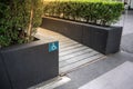 Ramped access, using wheelchair ramp with information sign on fl