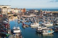 Yachts moored in the marina of the impressive historic Royal Harbour