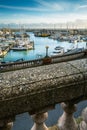 Ramsgate Royal Harbour seen beyond the balustrades of the Royal Parade in the Isle of Thanet, Kent, UK