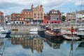 Ramsgate Royal Harbour with waterside impressive architecture reflecting in the harbour basin alongside