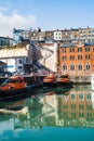Ramsgate, UK - Feb 6 2023. Distinctive buildings and boats in Ramsgate Royal Harbour reflecting in the water of the marina