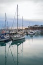 Yatchs moored in Ramsgate Royal Harbour at dusk on a winter day