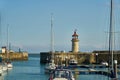 Ramsgate, United Kingdom - April 30, 2021: Ramsgate Lighthouse stands next to the main harbour entrance.