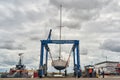 Ramsgate, United Kingdom - May 25, 2021: A Boat Hoist Crane Lifts a Yacht