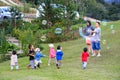 Cute little children playing bubbles on a hill at one of Borneo`s highlands, Ranau, Sabah