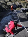 Ranau, Sabah Malaysia-30th March 2021. Unidentified climbers are descending using wooden ladders and ropes from the mountain. Royalty Free Stock Photo