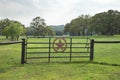 Ranch gate with pasture and trees in the Texas Hill Country