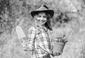 Ranch girl. Little kid hold flower pot. Spring country works. Happy childrens day. Happy childhood. Child in hat with Royalty Free Stock Photo