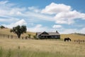 ranch house with view of rolling hills and fields, with horse and cattle grazing Royalty Free Stock Photo