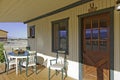 Ranch porch overlooking horse stables Royalty Free Stock Photo