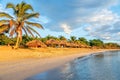 Rancho Luna caribbean beach with palms and straw umbrellas on the shore, Cienfuegos, Cuba Royalty Free Stock Photo