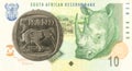 5 rand coin against 10 south african rand bank note obverse