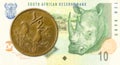 0,5 rand coin against 10 south african rand bank note obverse