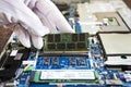 Random access memory for replacement to laptop computer. RAM module DDR in hand on the background of a modern notebook-transformer Royalty Free Stock Photo