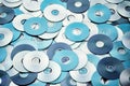 Random arrangement of silver blue grey DVD and CD data storage disks