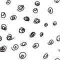 Random black ink scribbles of varying sizes scattered on a white background. Royalty Free Stock Photo