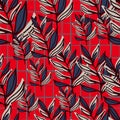 Random bright floral seamless pattern with branches. Red chequered background with navy blue and grey leaves Royalty Free Stock Photo