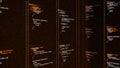 Random code in columns running on a computer screen, cypher or program source code scrolling on dark background Royalty Free Stock Photo