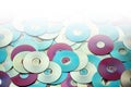 Random arrangement of metallic DVD and CD data storage disks Royalty Free Stock Photo