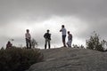 Random hikers communicating at the top of a mountain in the Adirondacks