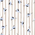 Random little blue crane bird shapes seamless pattern in hand drawn style.Striped lilac and white background Royalty Free Stock Photo