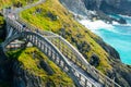 Random people standing on the bridge at Mizen Head Signal Station, Ireland Royalty Free Stock Photo