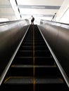 A random person walking on the escalator in AG-DMS Chennai, Tamil Nadu