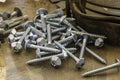 Random pile of hexagonal threaded steel bolts or screws. Royalty Free Stock Photo