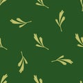 Random seamless doodle pattern with beige doodle leaves print. Green background. Herbal elements Royalty Free Stock Photo