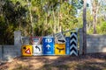 Random signs attached to a farm gate Royalty Free Stock Photo