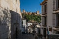 Street of Granada with a view of Alhambra palace, Granada, Andalusia, Spain.