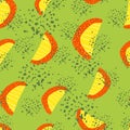 Random summer seamless pattern with fruit slices silhouettes. Yellow and red color fruit figures on green background with splashes Royalty Free Stock Photo